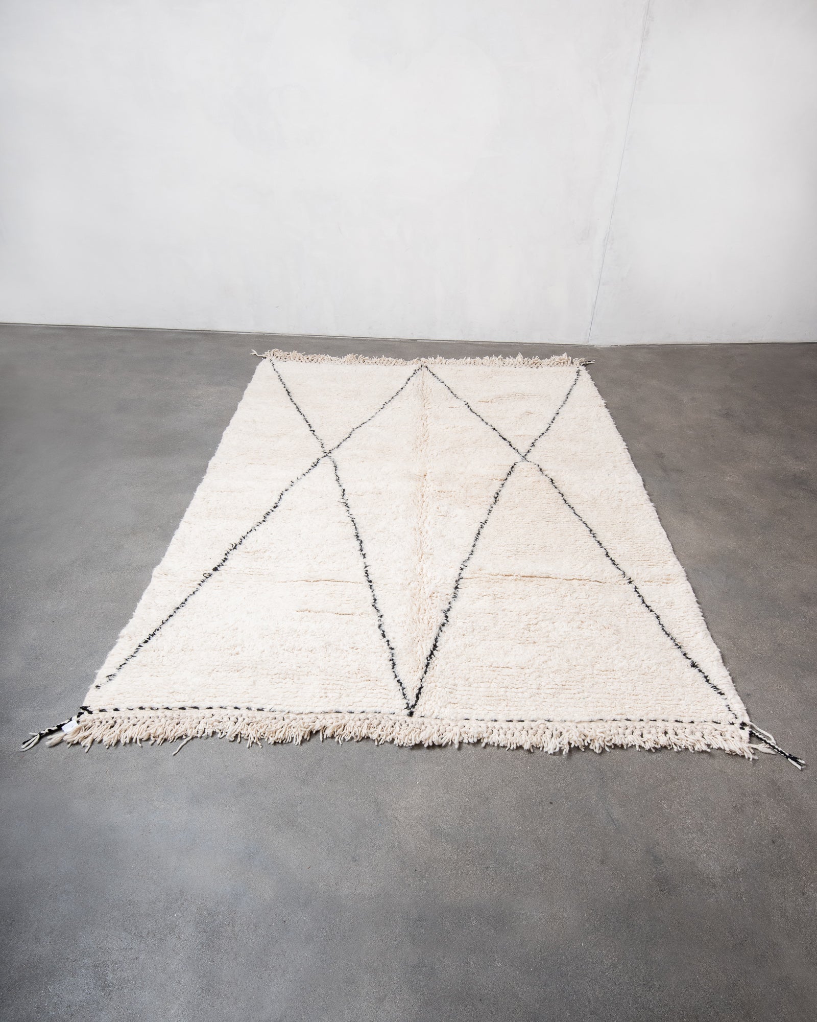 Modern, designer, handcrafted Berber rug from Morocco. Beniourain carpet with minimalist design, natural wool pile and a fluffy texture.